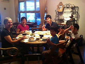 Travelers Enjoying a Home Cooked Japanese Meal and Conservation at Nagomi Visit